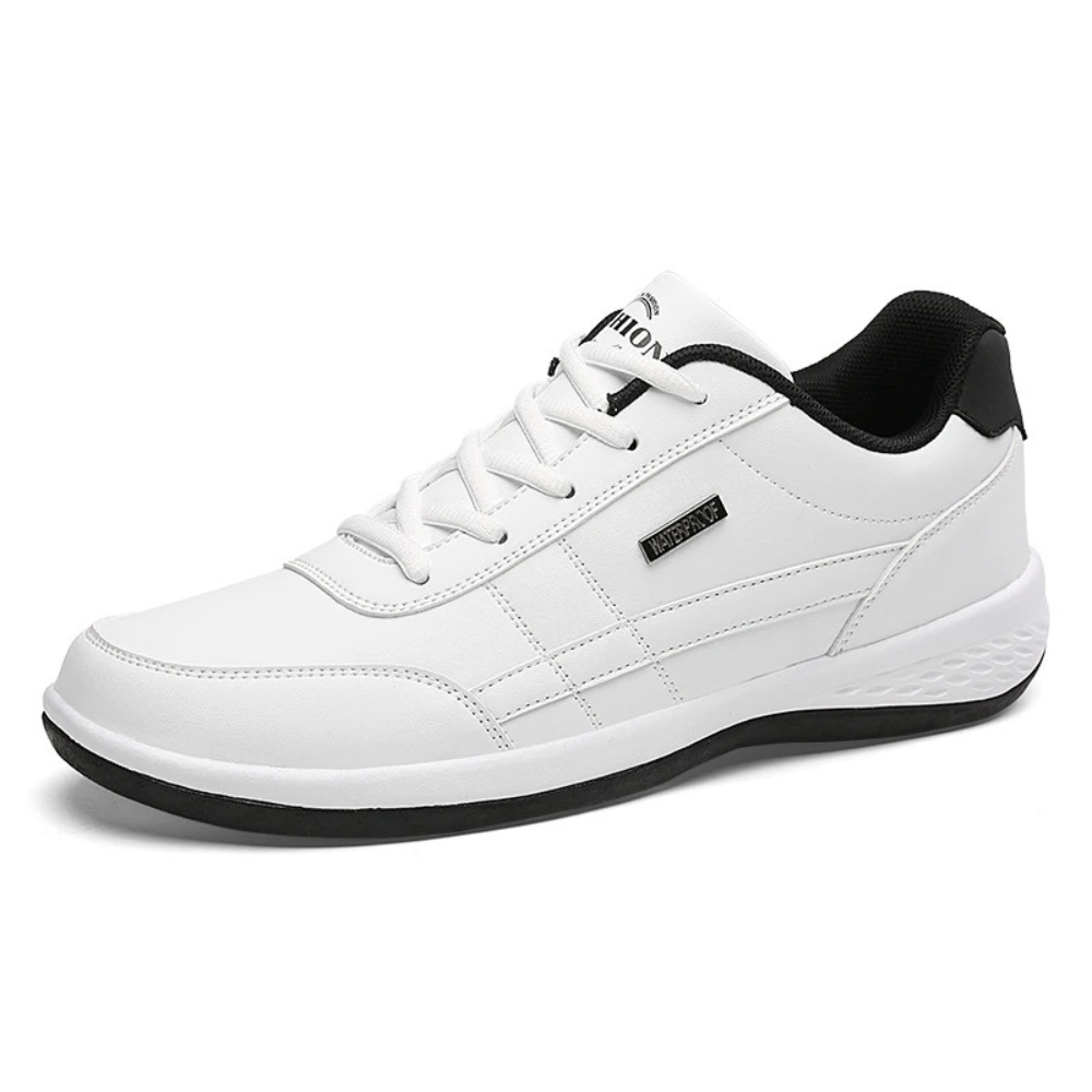 Black trainer with red stripe detail, studio product shot