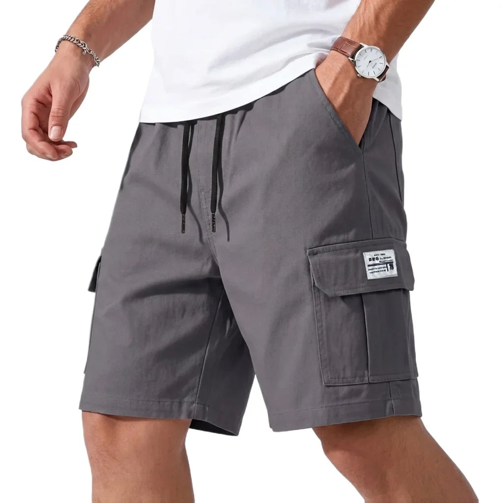 Jack cargo shorts in grey, front view with hand in pocket