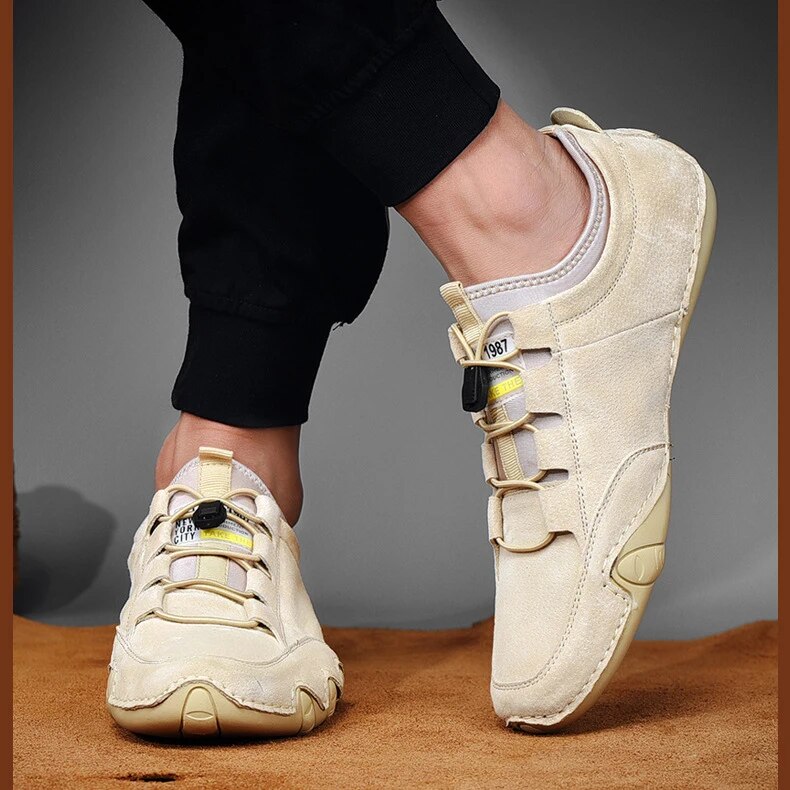 Jasper slip-on trainer worn on foot, close-up of toggle lace and stitching