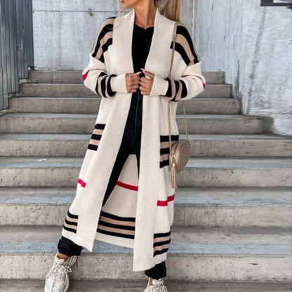 Claire striped longline cardigan in white colourblock stripe, styled on stairs with crossbody bag