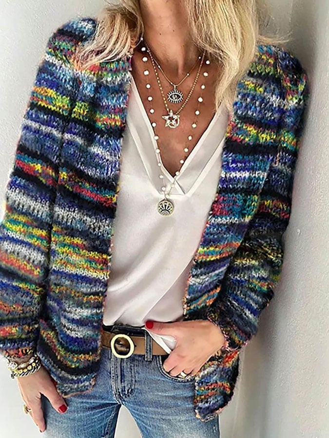 Freya striped knit cardigan in a blue-toned colourway, styled with a white blouse and layered necklaces