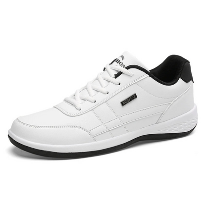 Black trainer with red stripe detail, studio product shot