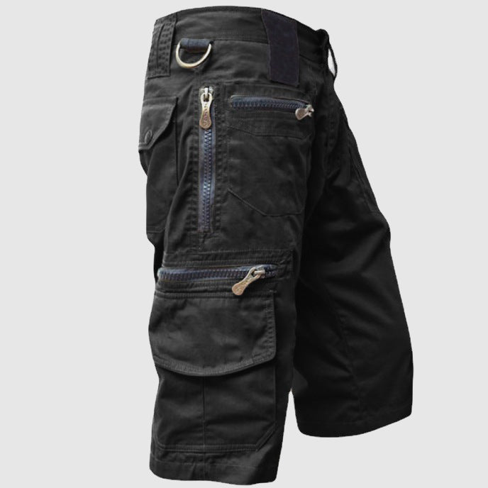 Harvey utility cargo shorts in black, side view showing zip pockets