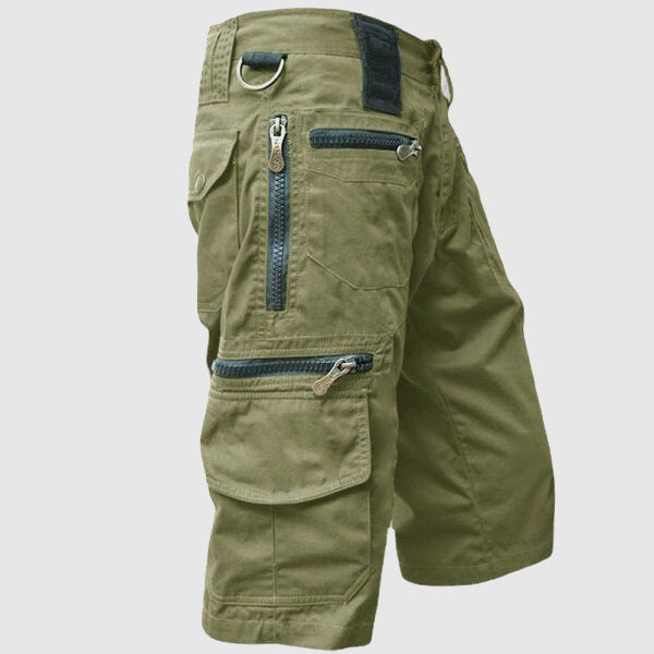 Harvey utility cargo shorts in olive green, side view showing zip pockets
