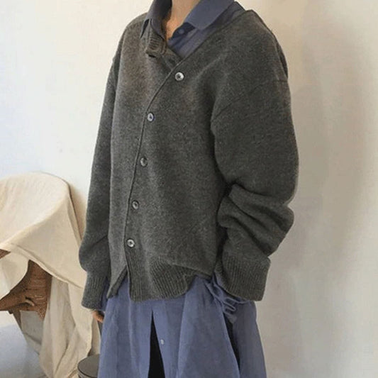 Hazel asymmetric button cardigan, side view over collared shirt