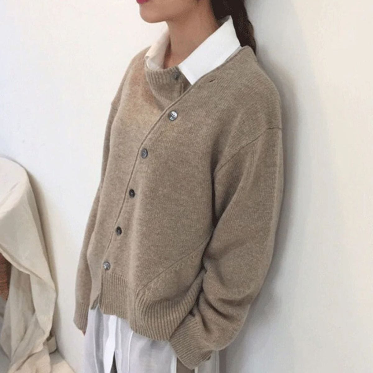 Hazel asymmetric button cardigan in neutral tone, side view