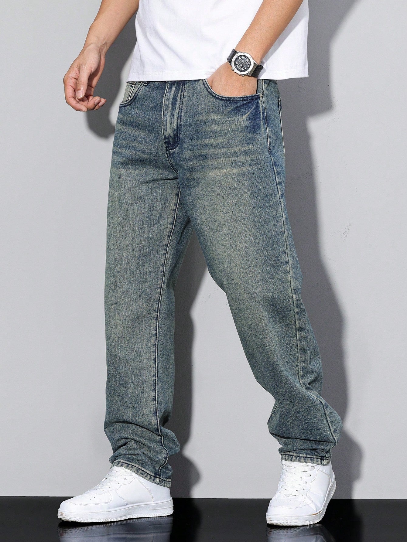 Jack casual straight-leg jeans in mid blue wash, side profile walking