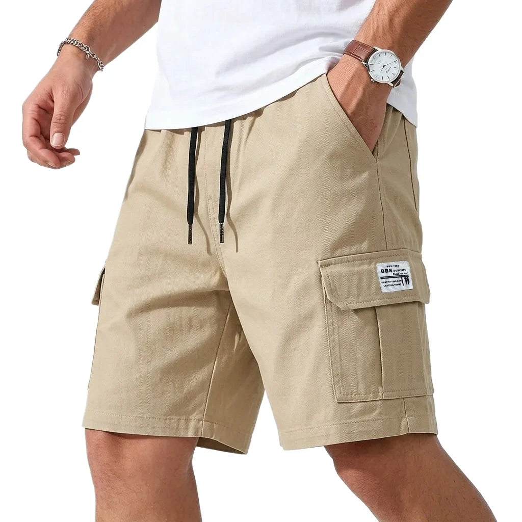 Jack cargo shorts in khaki, front view with hand in pocket