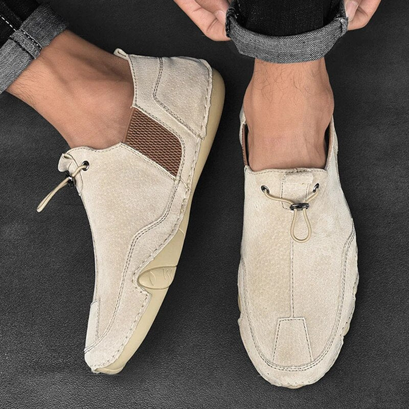 Jasper slip-on trainers worn on feet showing toggle lace detail, top view