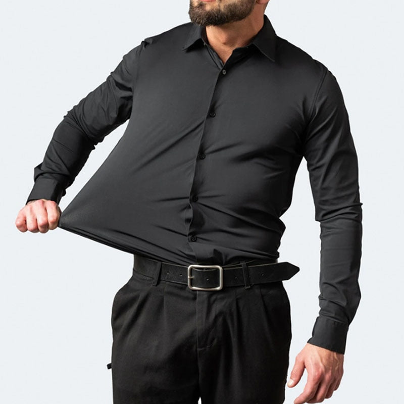 Model stretching the fabric of the black Julian shirt at the chest to show elasticity