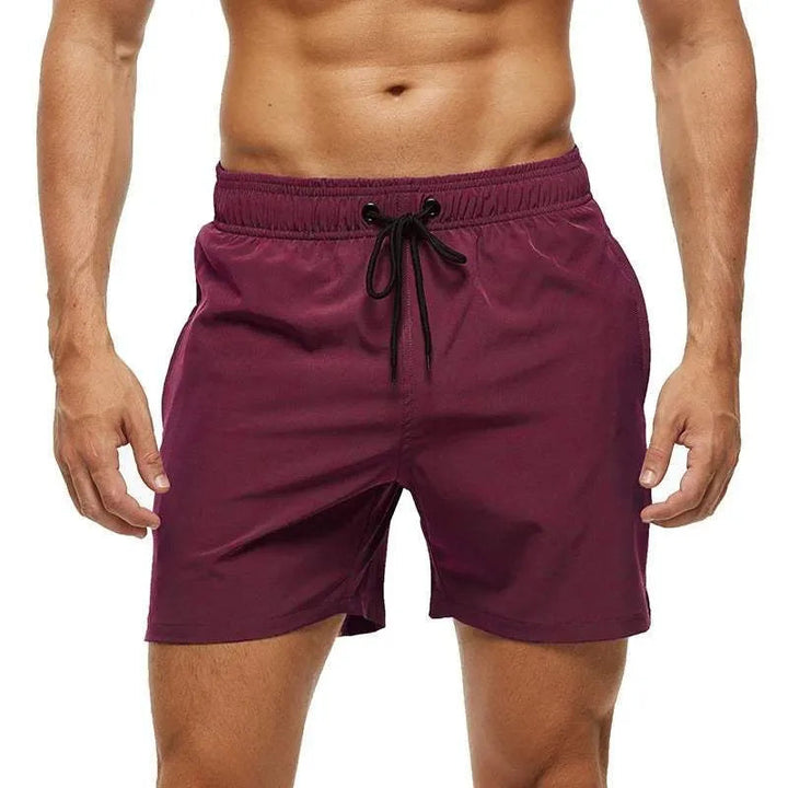 Kai burgundy swim shorts with black drawstring, front view