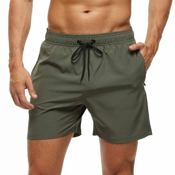 Kai olive green swim shorts with zip pocket, front view