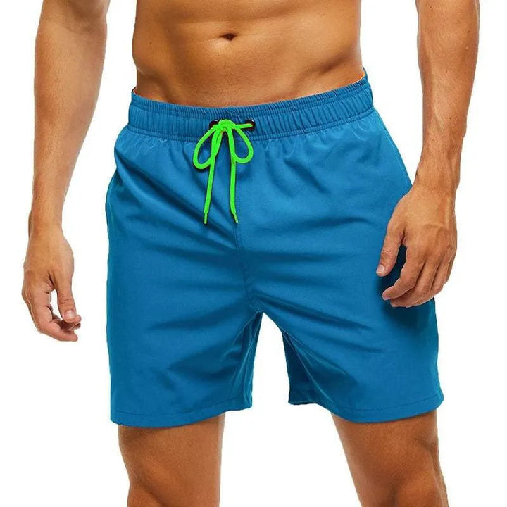 Kai blue swim shorts with green drawstring, front view