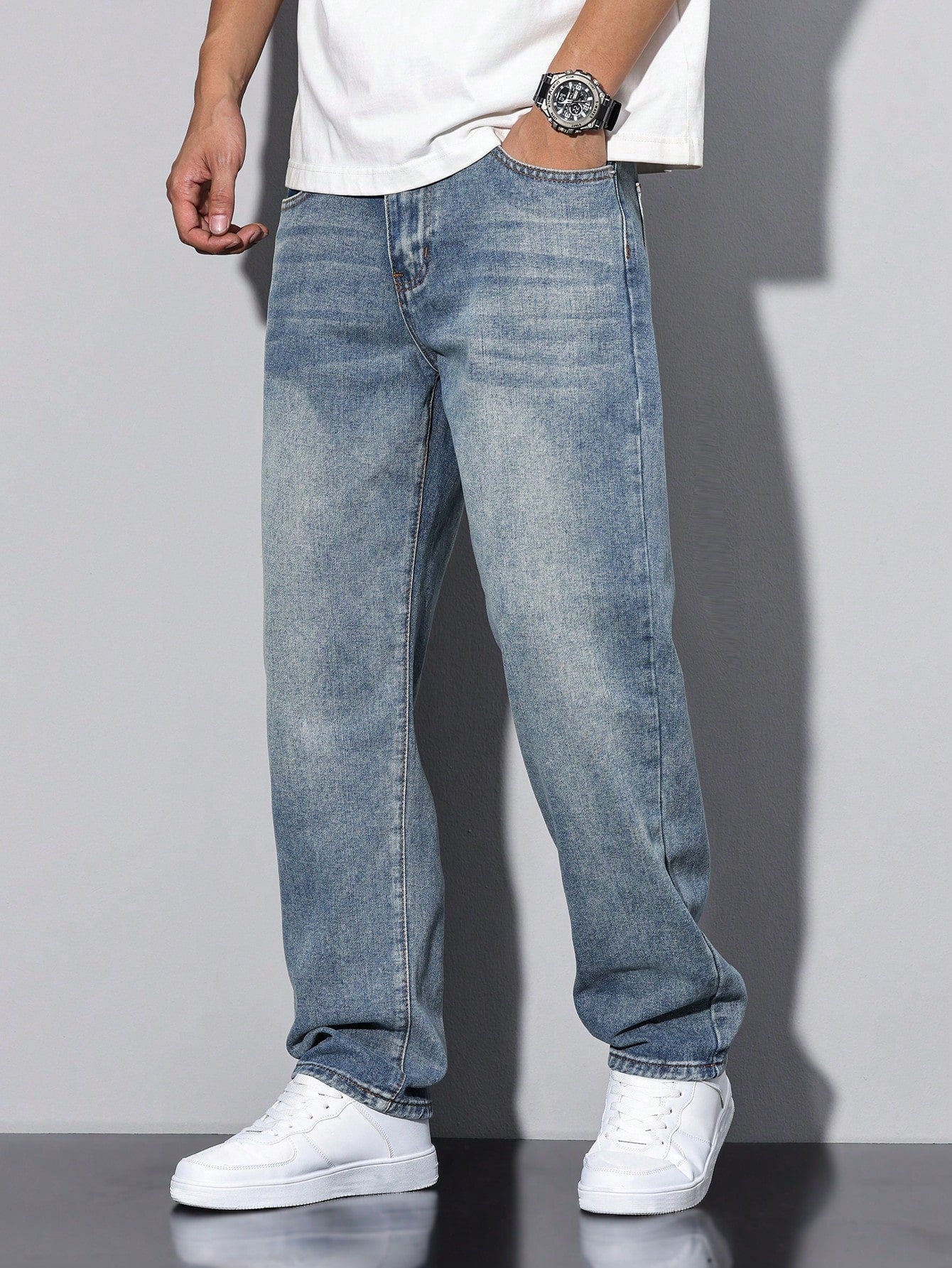 Lars men's washed straight leg jeans in light blue, side view walking