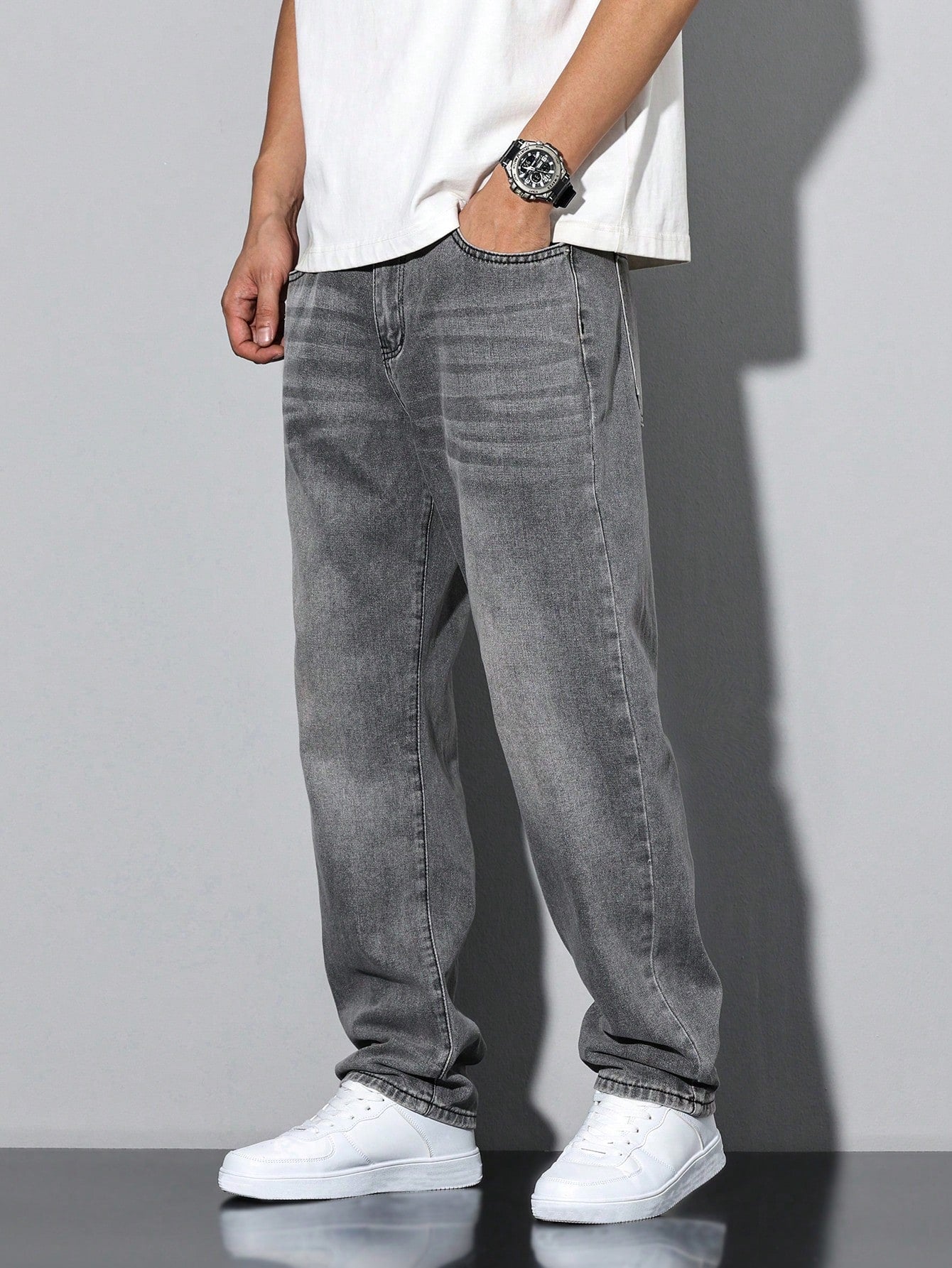 Lars men's washed straight leg jeans in grey, side view with hand in pocket