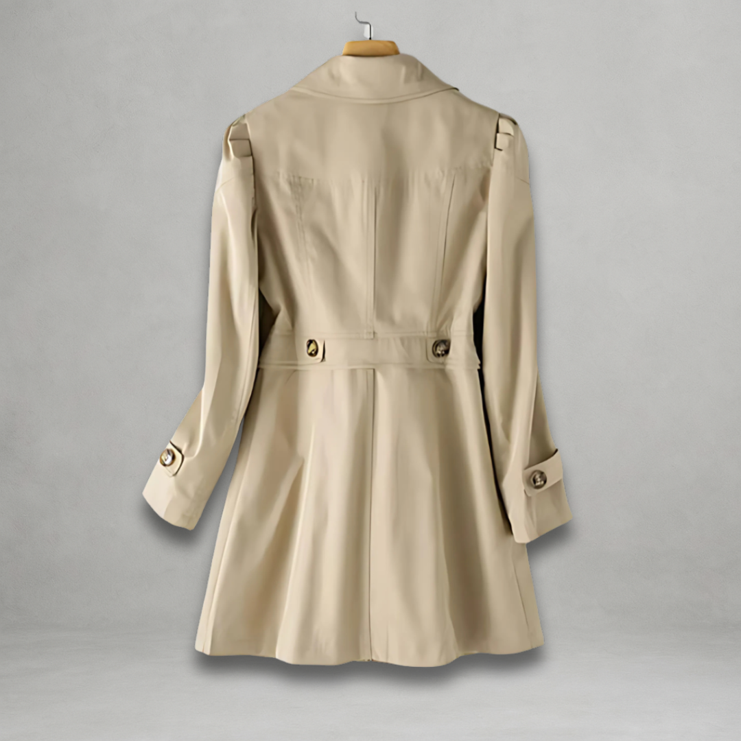 Margot trench coat back view showing waist tabs and tailored seams