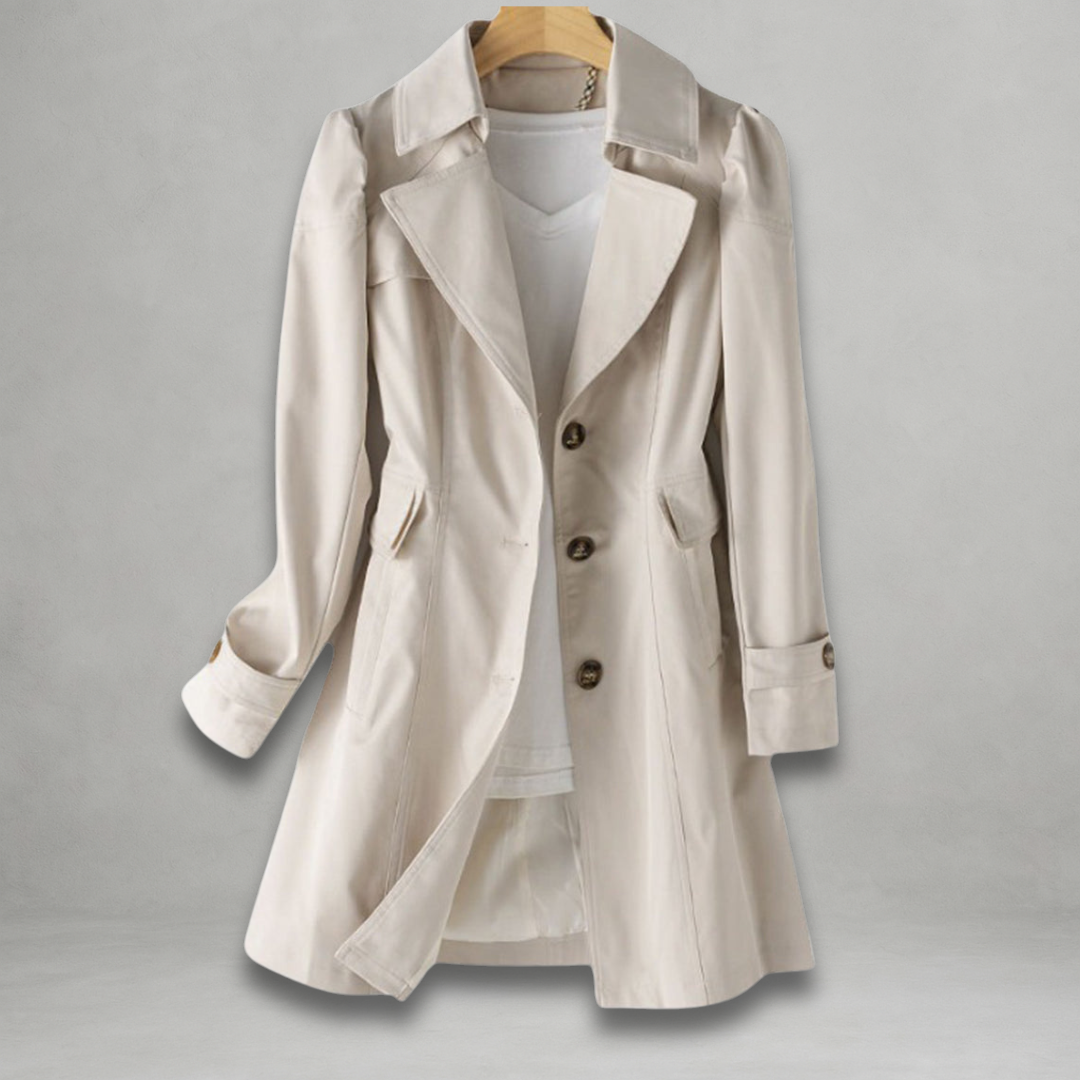 Margot trench coat in a light neutral shade, front view on hanger