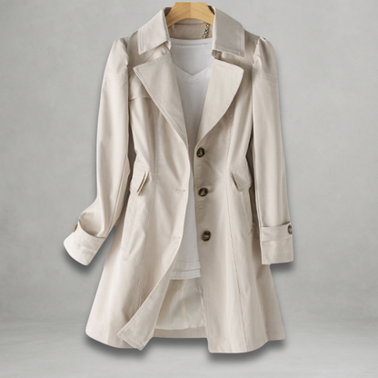 Margot trench coat in a light neutral shade, front view on hanger