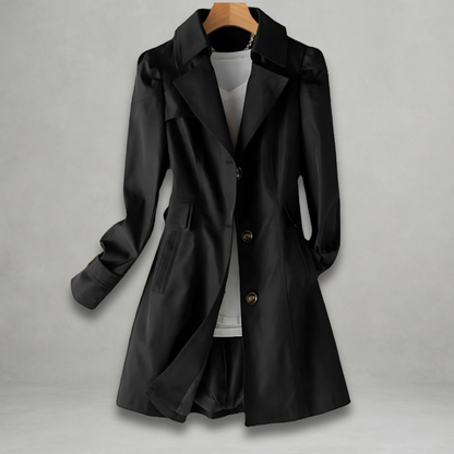 Margot trench coat in black, front view on hanger