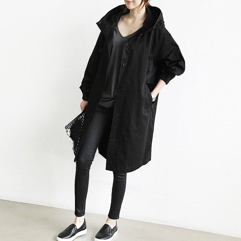 Margot black oversized hooded trench coat, front view with v-neck top