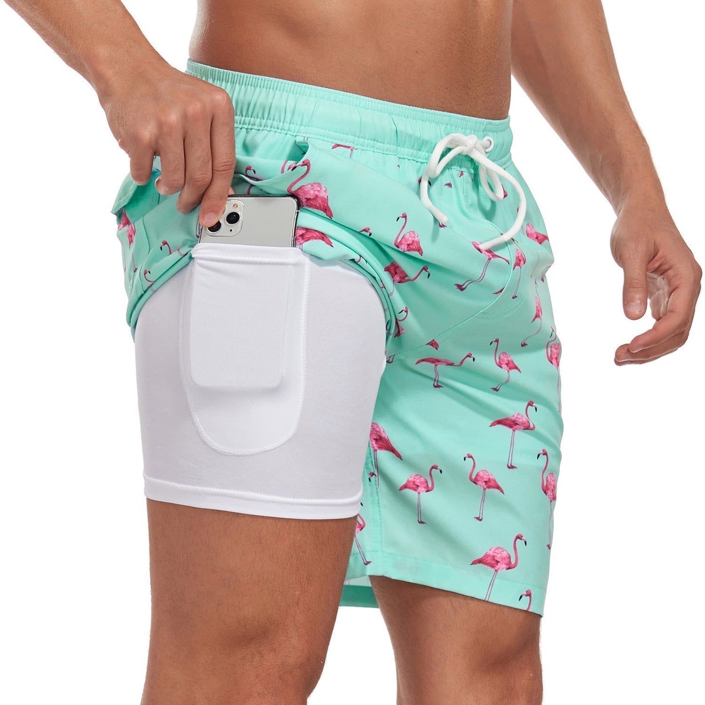 Noah mint flamingo print swim shorts, full side view with phone in hidden pocket