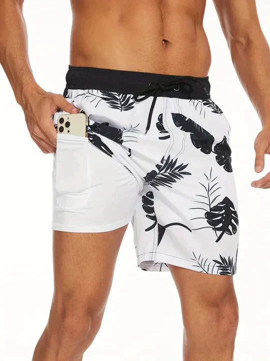 Noah white leaf print swim shorts, side view with phone in hidden pocket