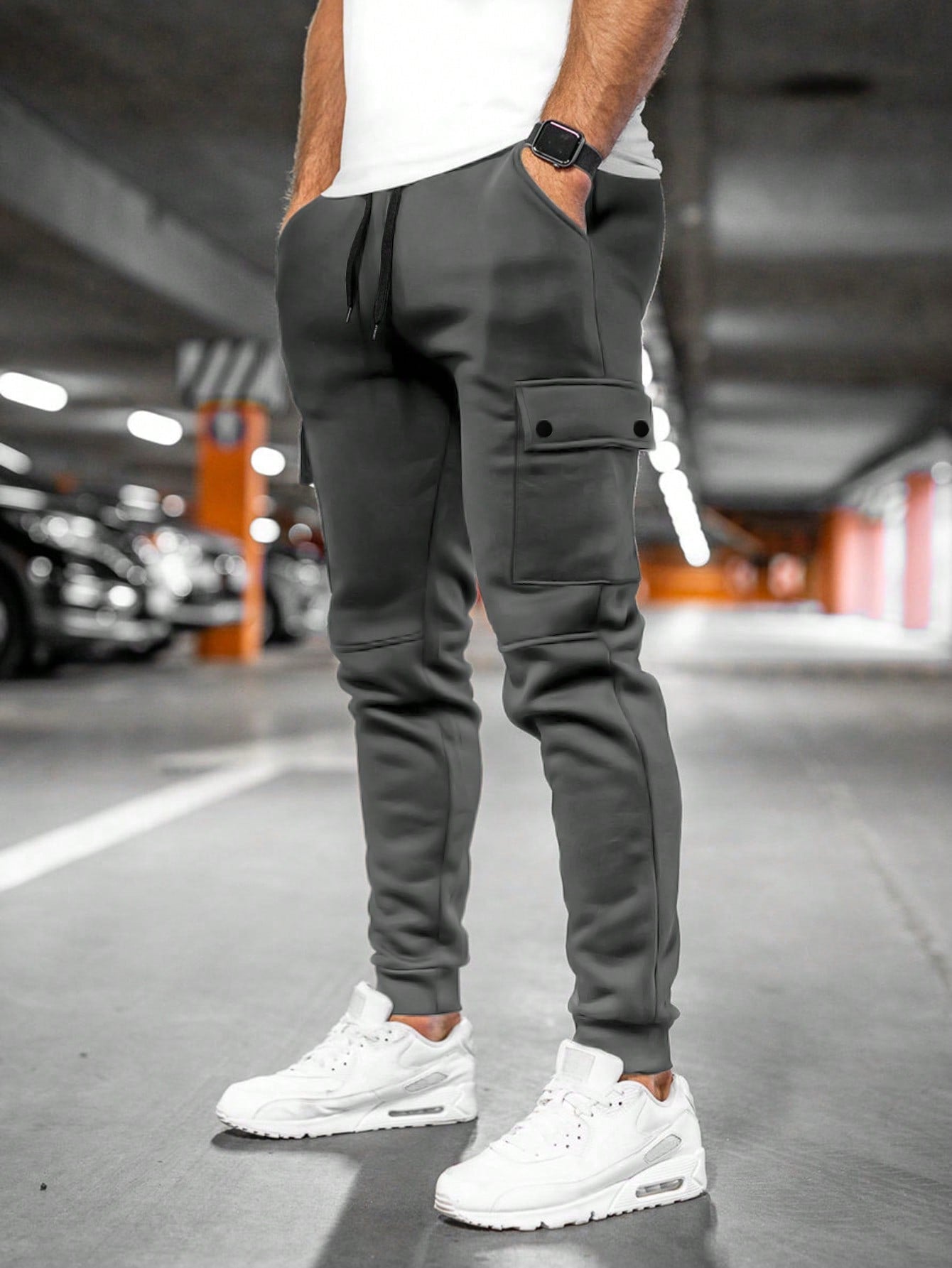 Tom cargo jogger trousers with flap pocket, back view in dark grey