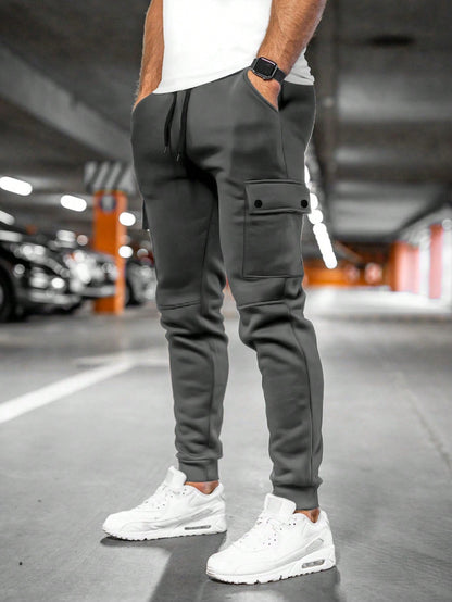 Tom cargo jogger trousers with flap pocket, back view in dark grey