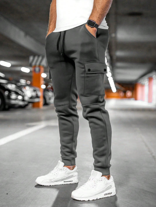 Tom cargo jogger trousers with flap pocket, back view in dark grey