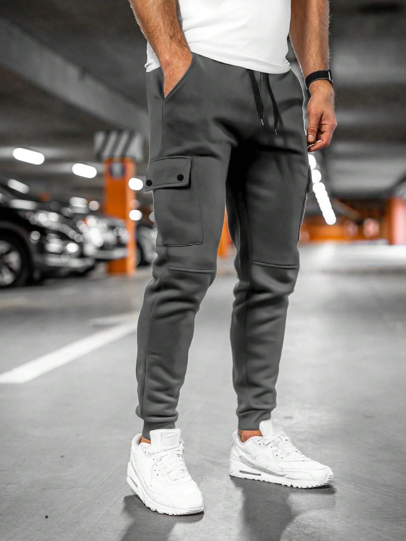 Tom cargo jogger trousers with flap pocket, front view in dark grey