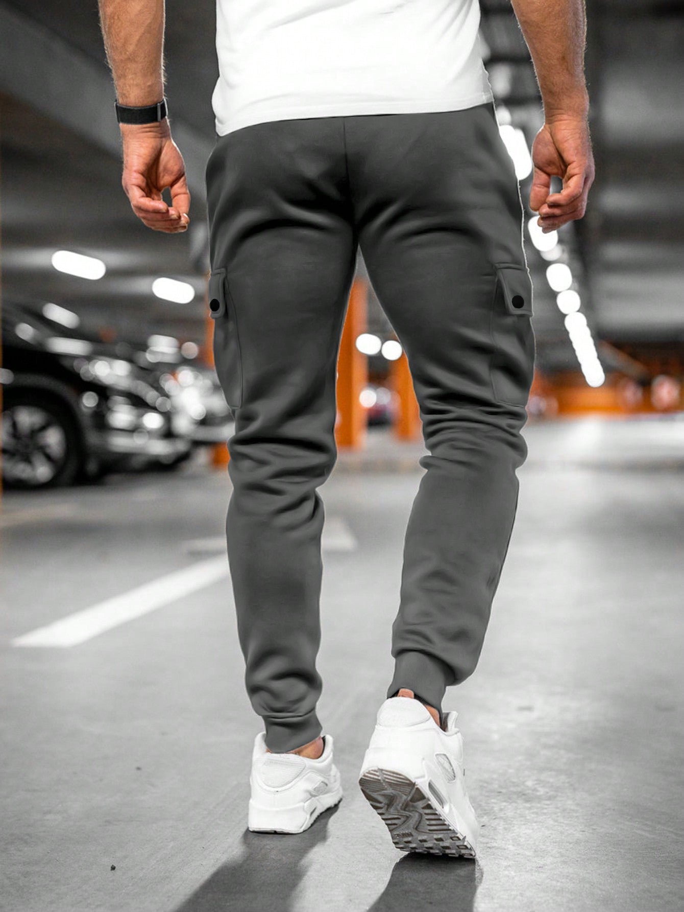 Tom cargo jogger trousers, back view walking in dark grey