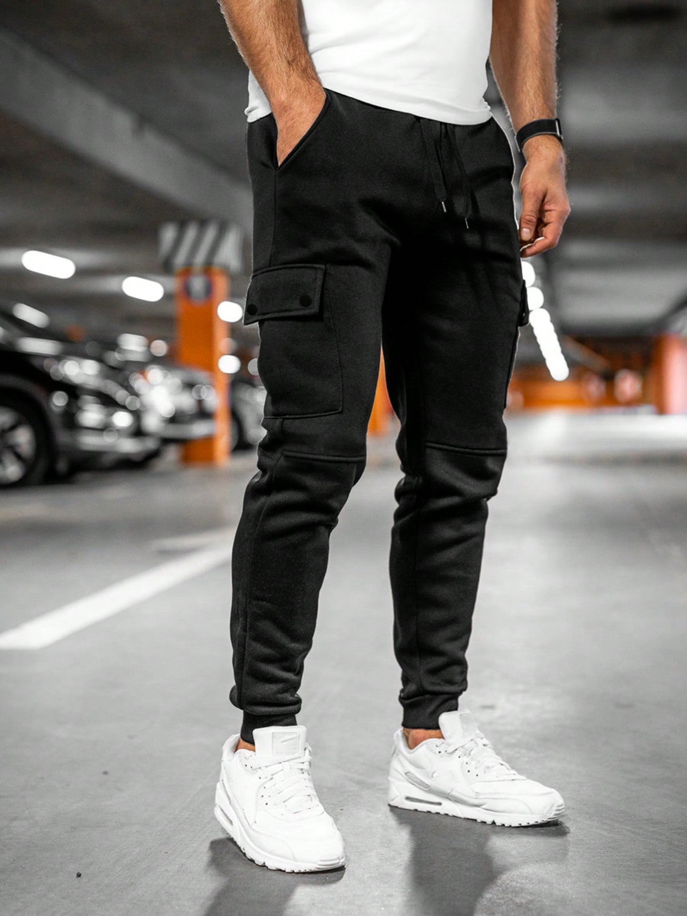 Tom cargo jogger trousers with flap pocket, front view in black