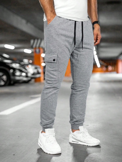 Tom cargo jogger trousers with flap pocket, front view in light grey