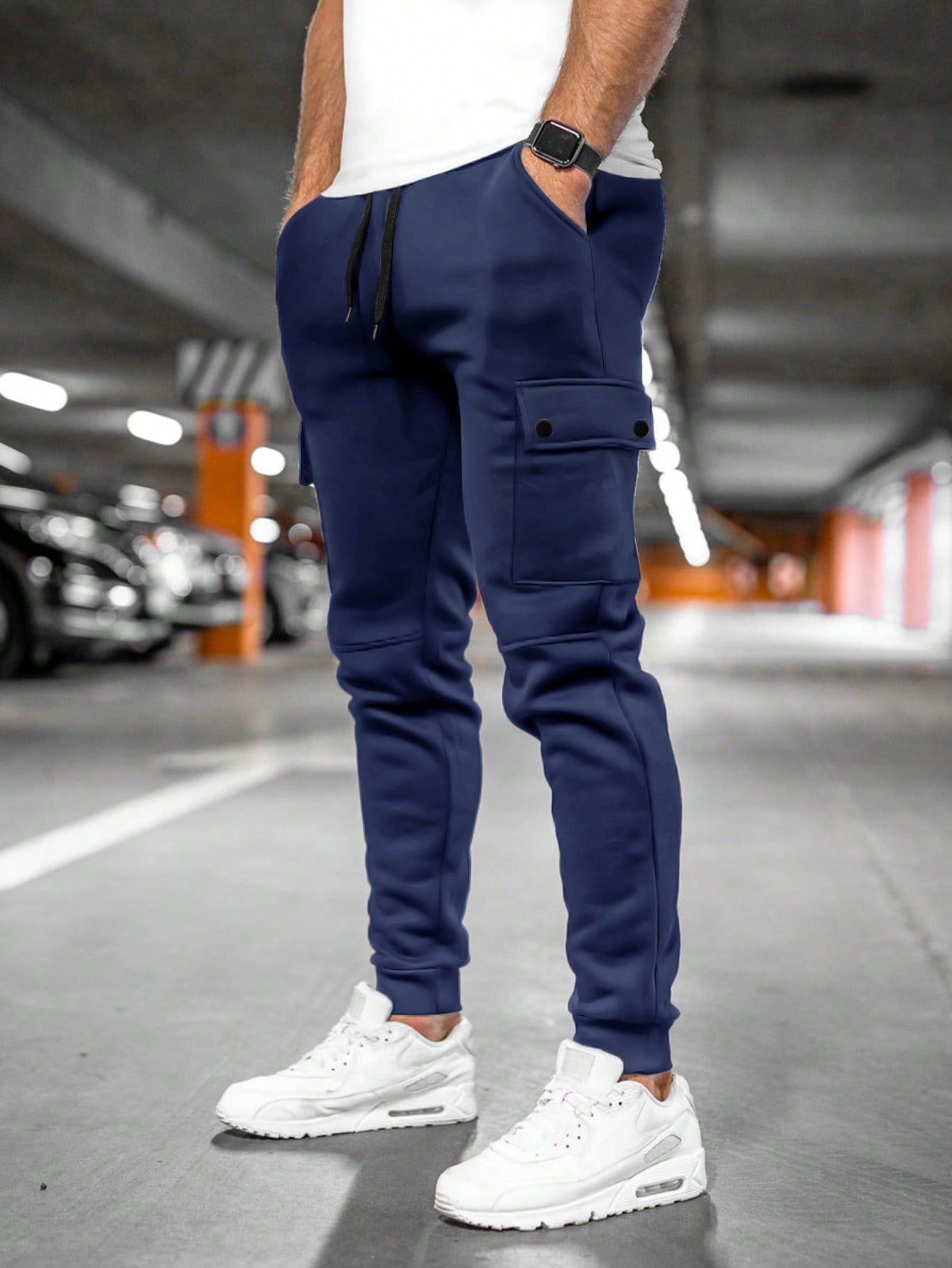 Tom cargo jogger trousers with flap pocket, back view in navy blue