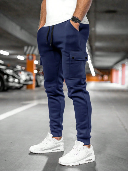 Tom cargo jogger trousers with flap pocket, back view in navy blue
