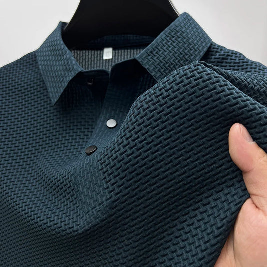 Winston navy textured knit polo shirt, close-up of collar and button placket